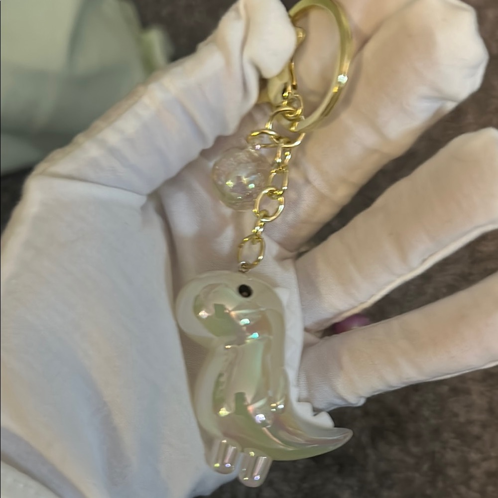 Iridescent Dinosaur Keychain with Gold Accents